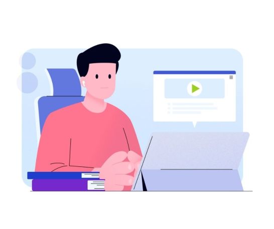 A man sits at a desk with books, using a tablet displaying online course